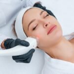 Woman-getting-a-laser-treatment-on-her-face-by-a-cosmetic-practitioner-scaled